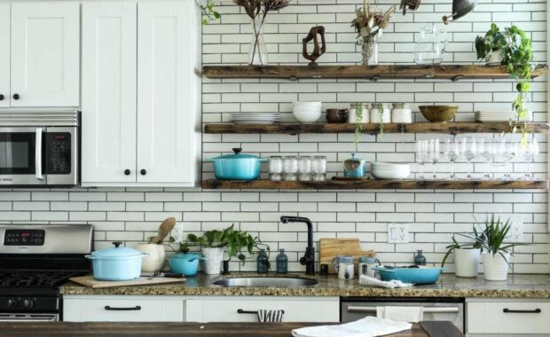 Kitchen with butcher block countertops and tile backsplash