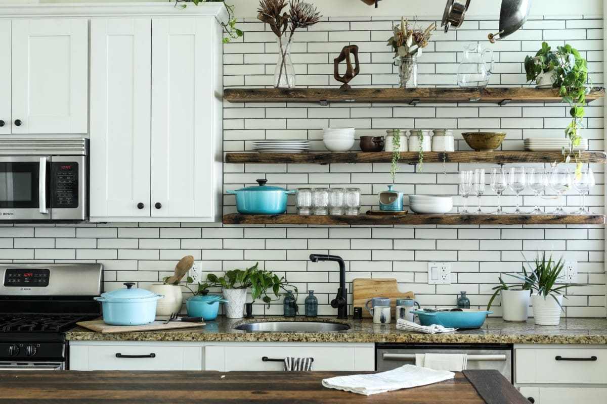 Kitchen with butcher block countertops and tile backsplash