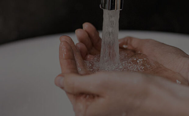 Woman Cupping Hands With Water