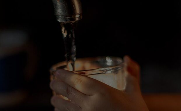 Water Getting Poured Into A Glass