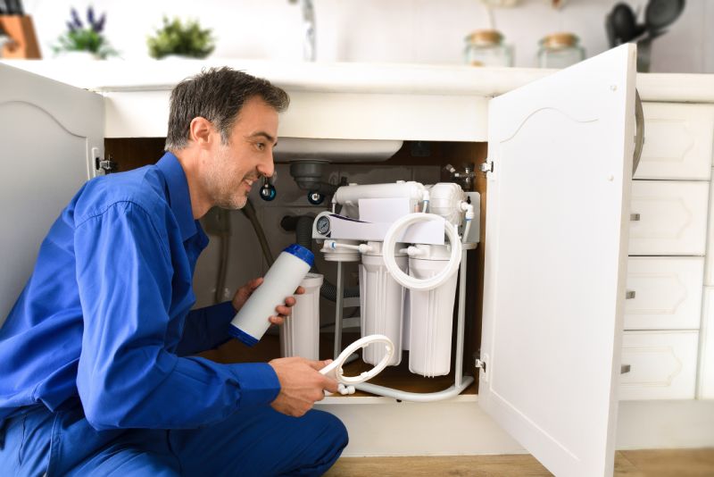 Reverse Osmosis Water Filtration System Getting Maintenance Done