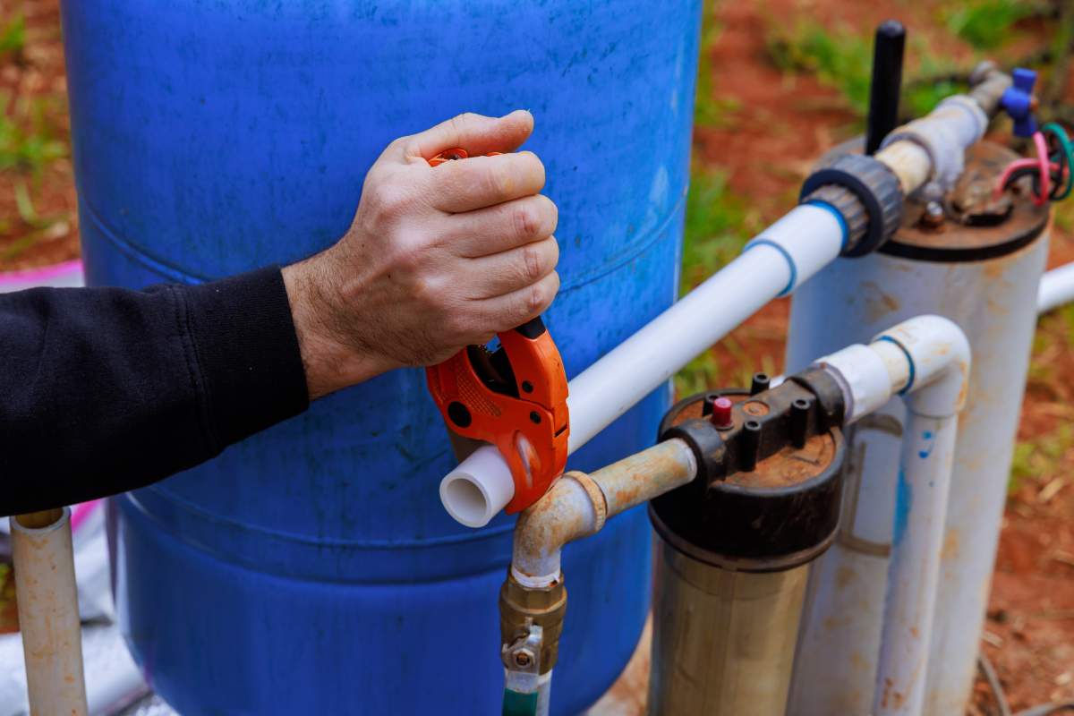 Technician Performing Well Pump Installation, Repair, & Maintenance Services