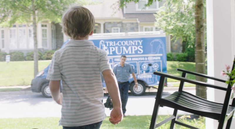 Little Boy Walking Towards Tri-County Pumps Truck