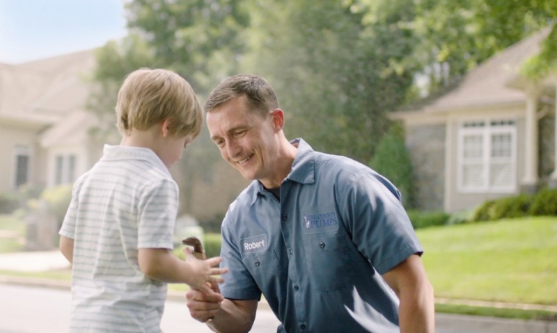 Maryland Plumber Giving Little Boy A Wrench