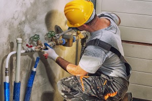 plumber implementing water treatment solutions