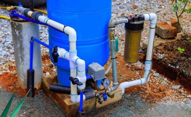 artesian water well system installed outdoors ensuring clean water supply for gardening home use