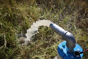 unfinished draw-well pumping the first underground water