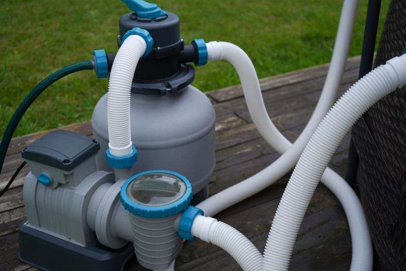 The outdoor pool's filtration system with a pump for ozone treatment and water purification.