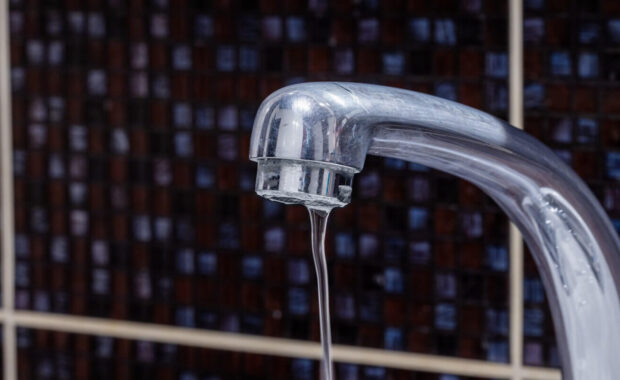 faucet at domestic bathroom with low water pressure. leaky tap repair