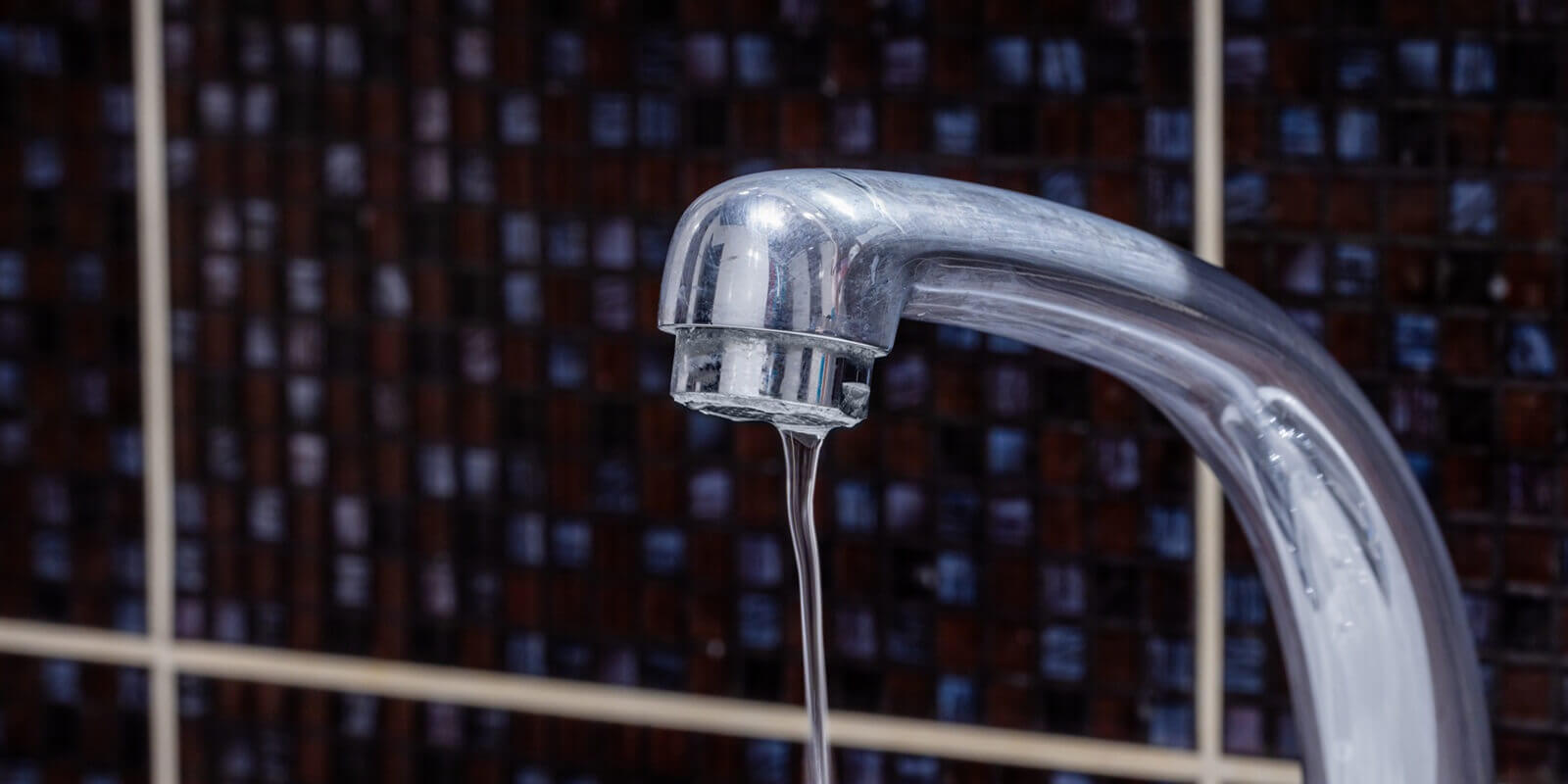 faucet at domestic bathroom with low water pressure. leaky tap repair