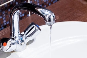 faucet at domestic bathroom with low water pressure. leaky tap repair