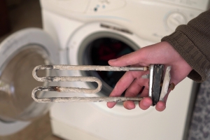 Treatment of Calcium Deposits in Water Heater. Limescale on the heating element for washing machine. Replacing a heating element