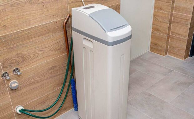 water softener standing in the boiler room with the lid closed