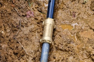 brass joint connector attached to the old and new water pipe