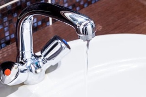 faucet at domestic bathroom with low water pressure. leaky tap repair