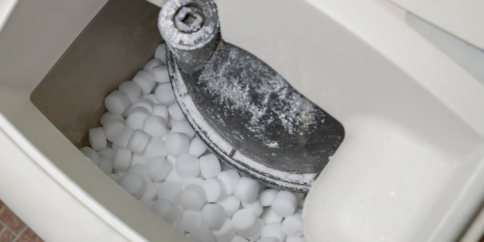 salt pellets lies in water softener