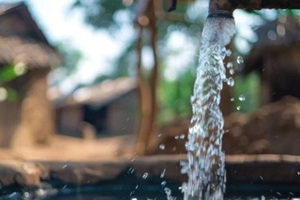 community well providing clean water with modern purification systems, close up, selective focus