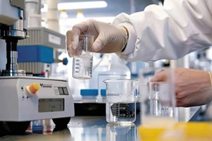 expert testing water in lab with modern equipments